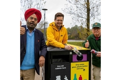 Image Members of Hubub and McDonalds together around a recycling can.